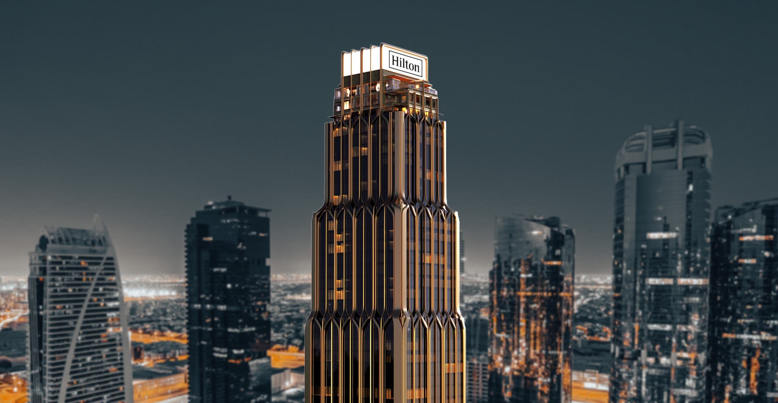 Hilton Residences Dubai JLT tower exterior at night with illuminated cityscape