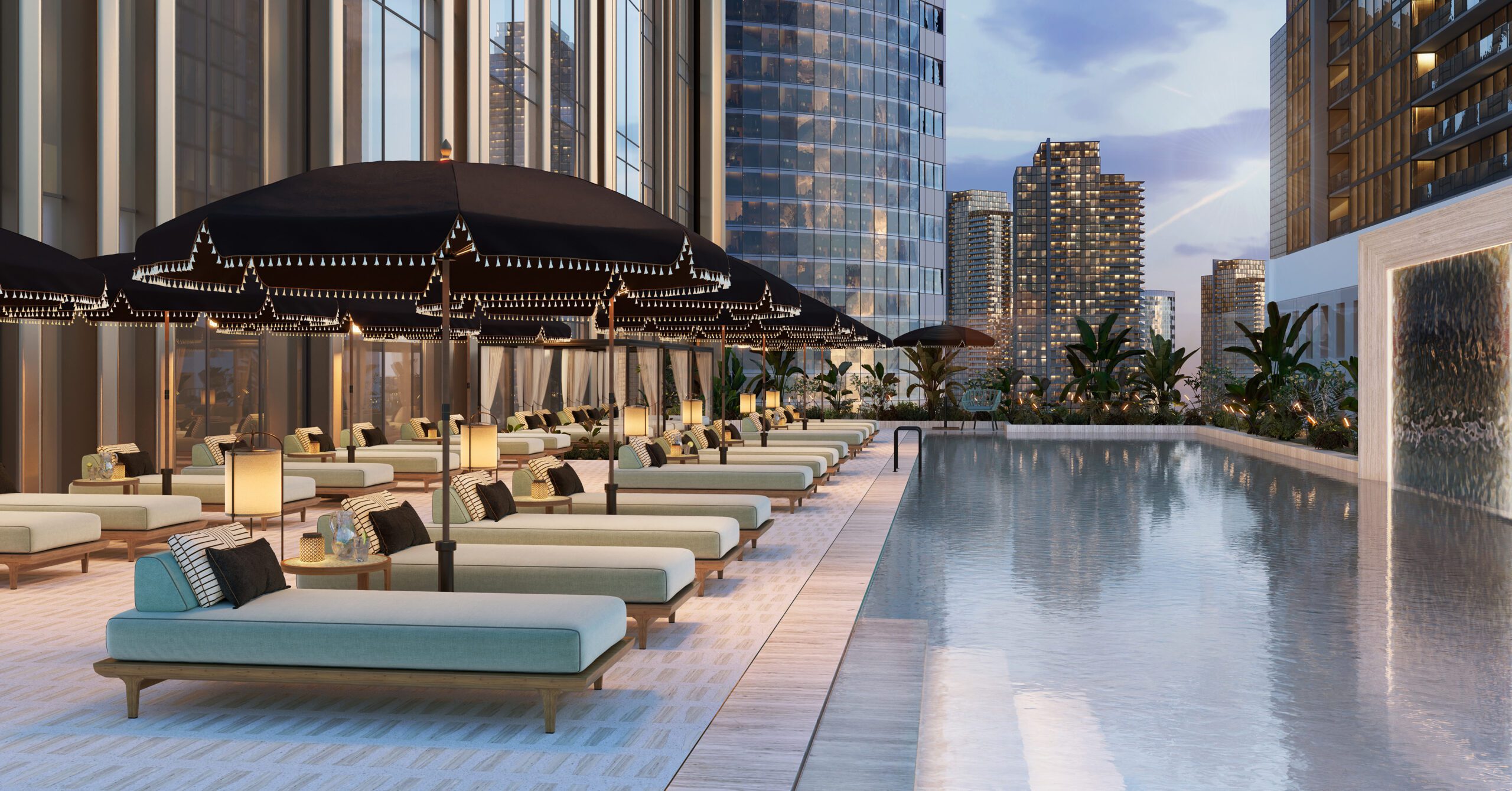 Hilton Residences Dubai JLT infinity pool terrace with skyline views at dusk